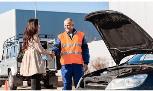 Roadside Assistance professional shaking hands with a customer