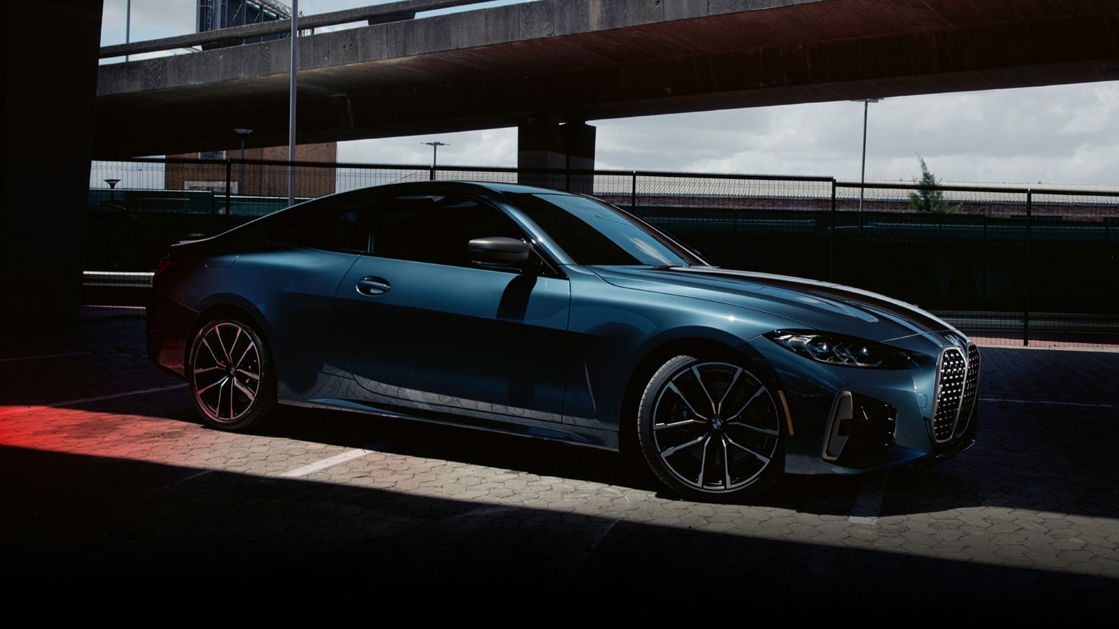 Sculpted rear wheel arches accentuate the muscular proportions of the 2021 BMW 4 Series Coupe.